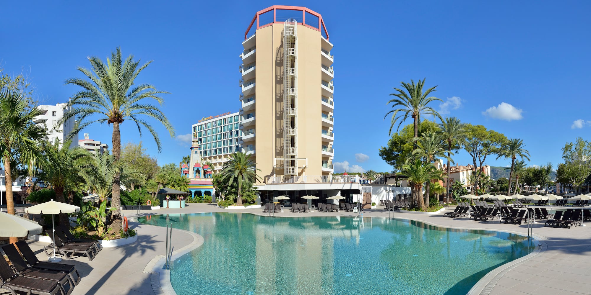 a pool with a building in the background