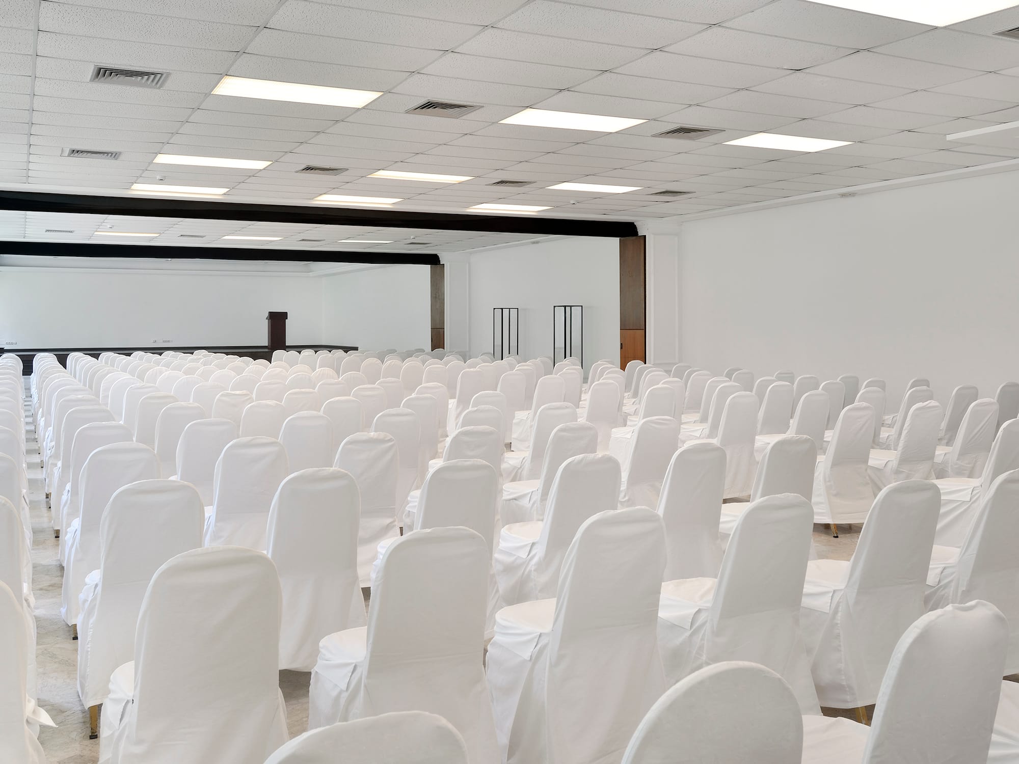 a room with white chairs