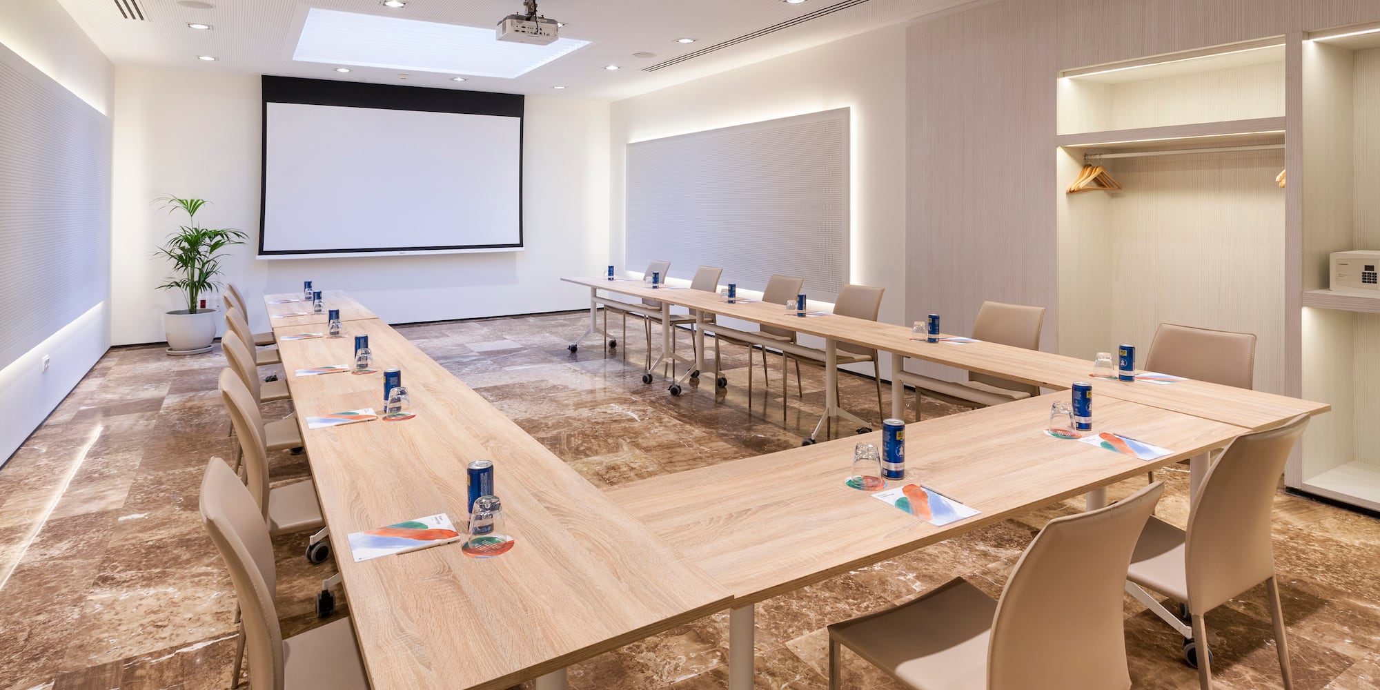 a room with a large table and chairs