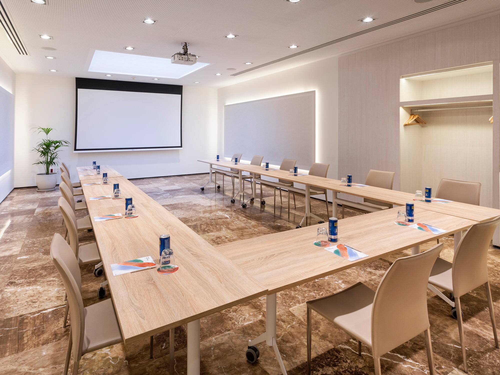 a room with a large table and chairs