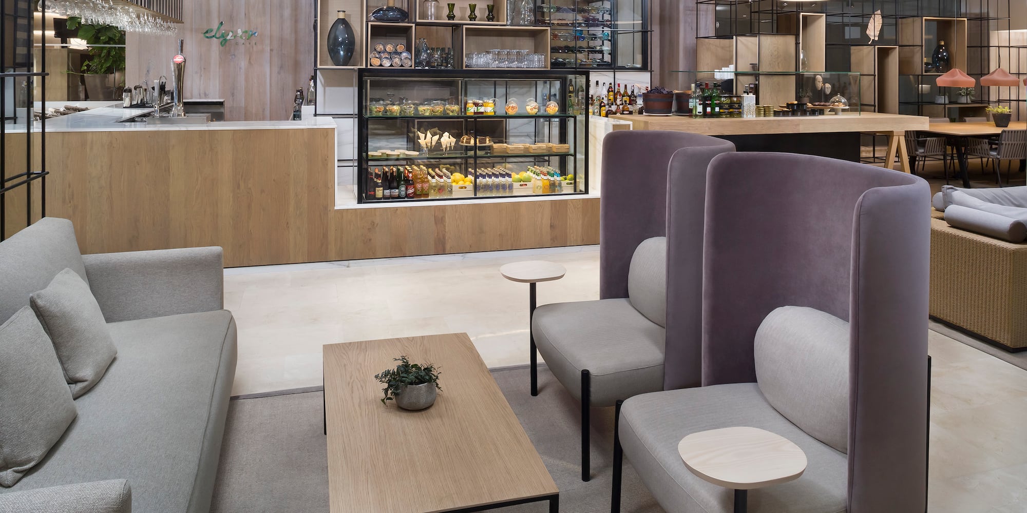 a room with a coffee table and chairs