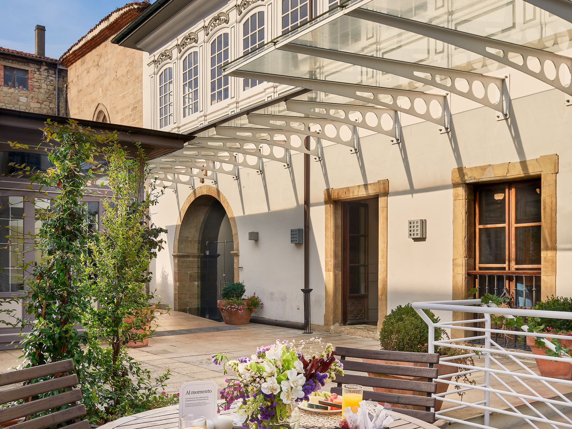 a table with food on it outside of a building