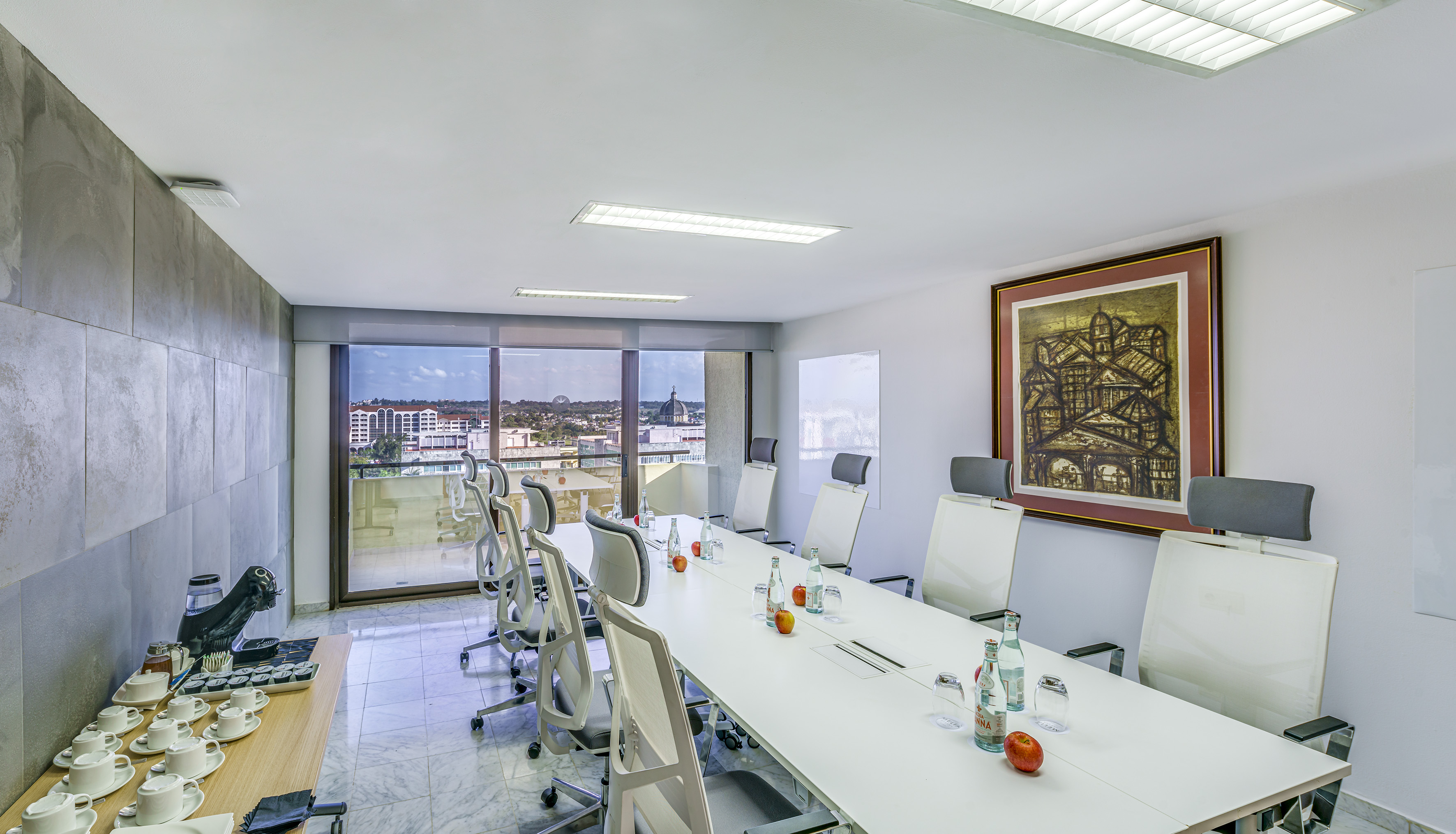 a conference room with a table and chairs