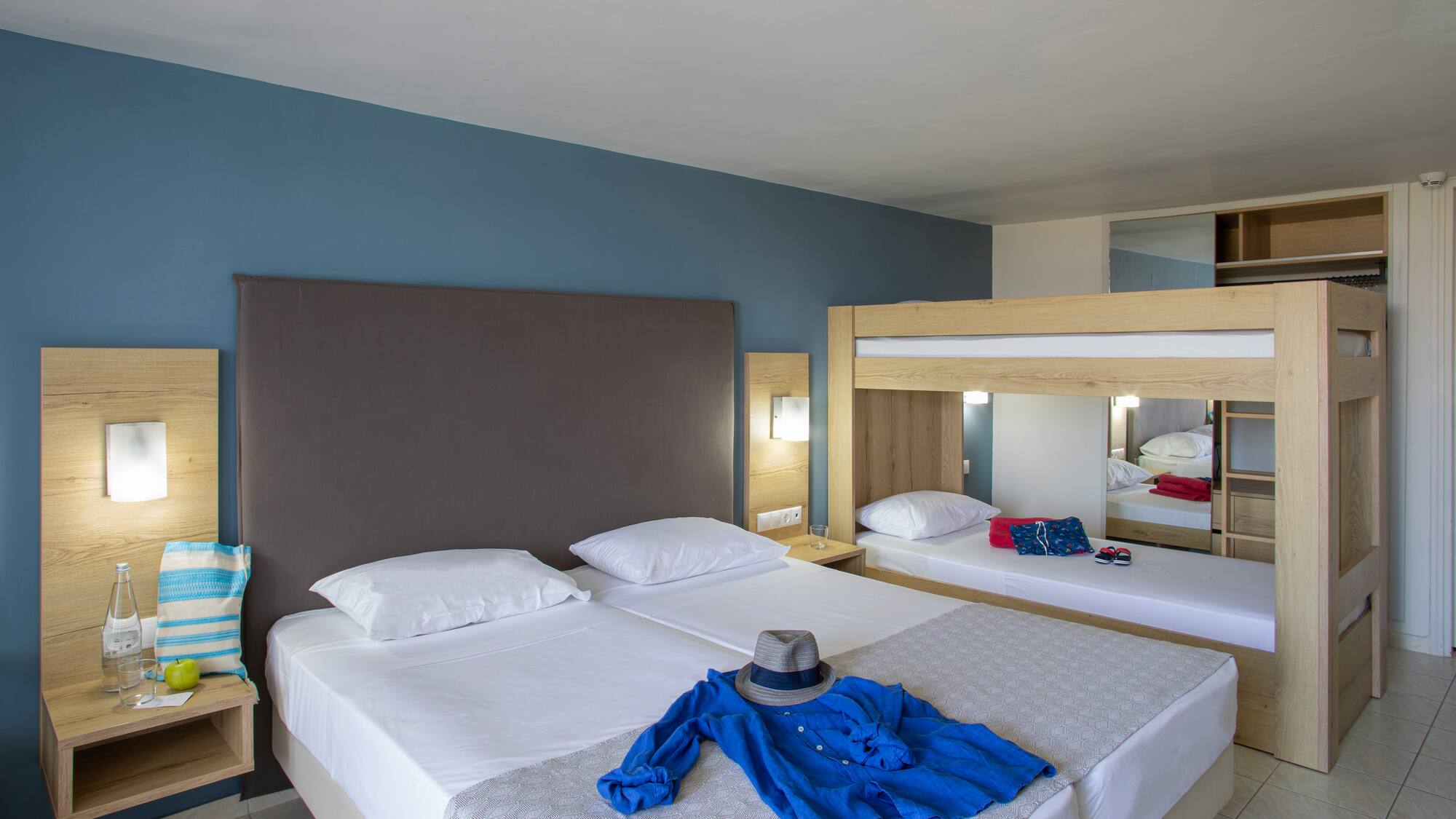 a room with a bed and a hat on it