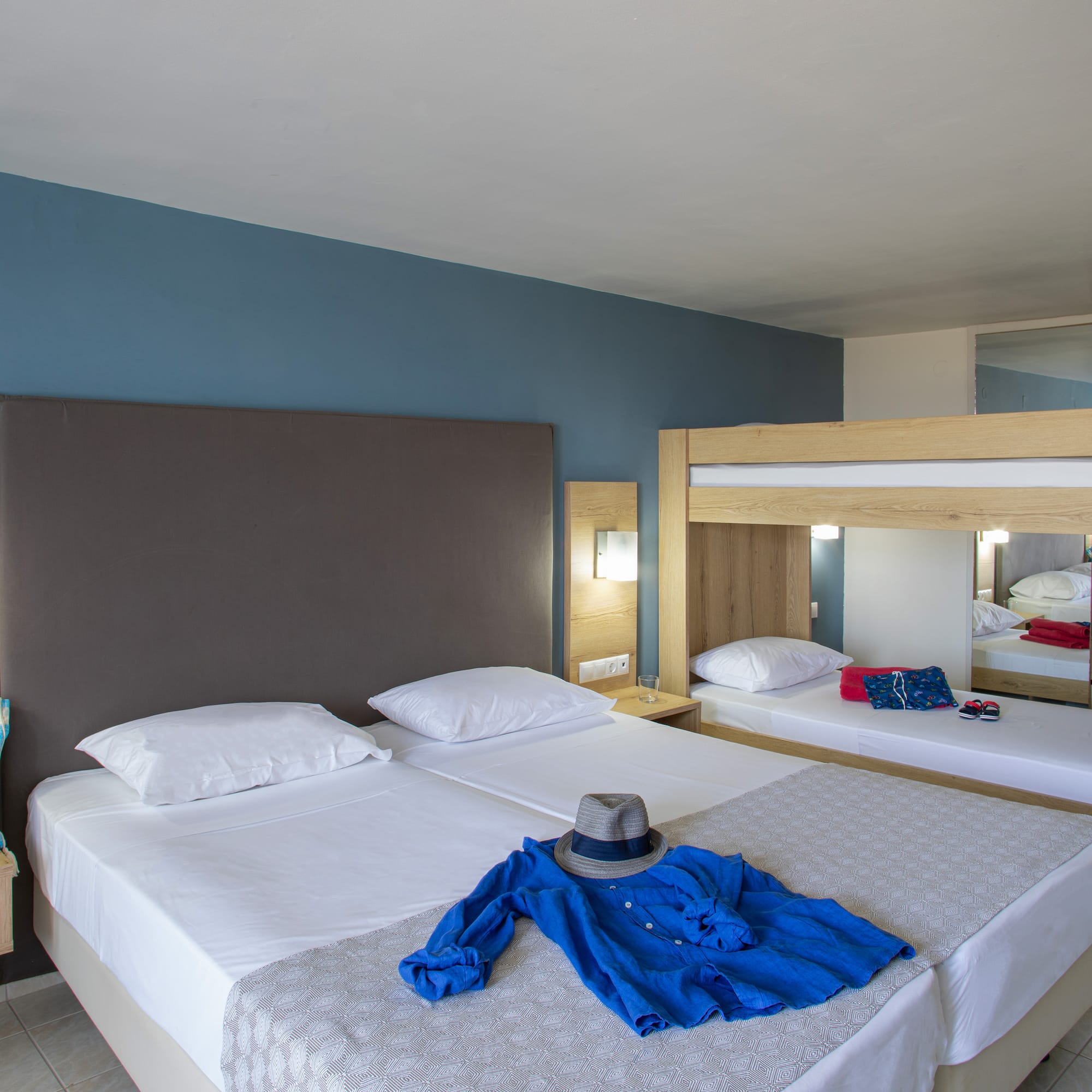 a room with a bed and a hat on it