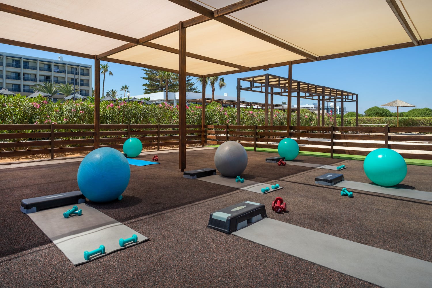 a group of yoga mats and balls on mats