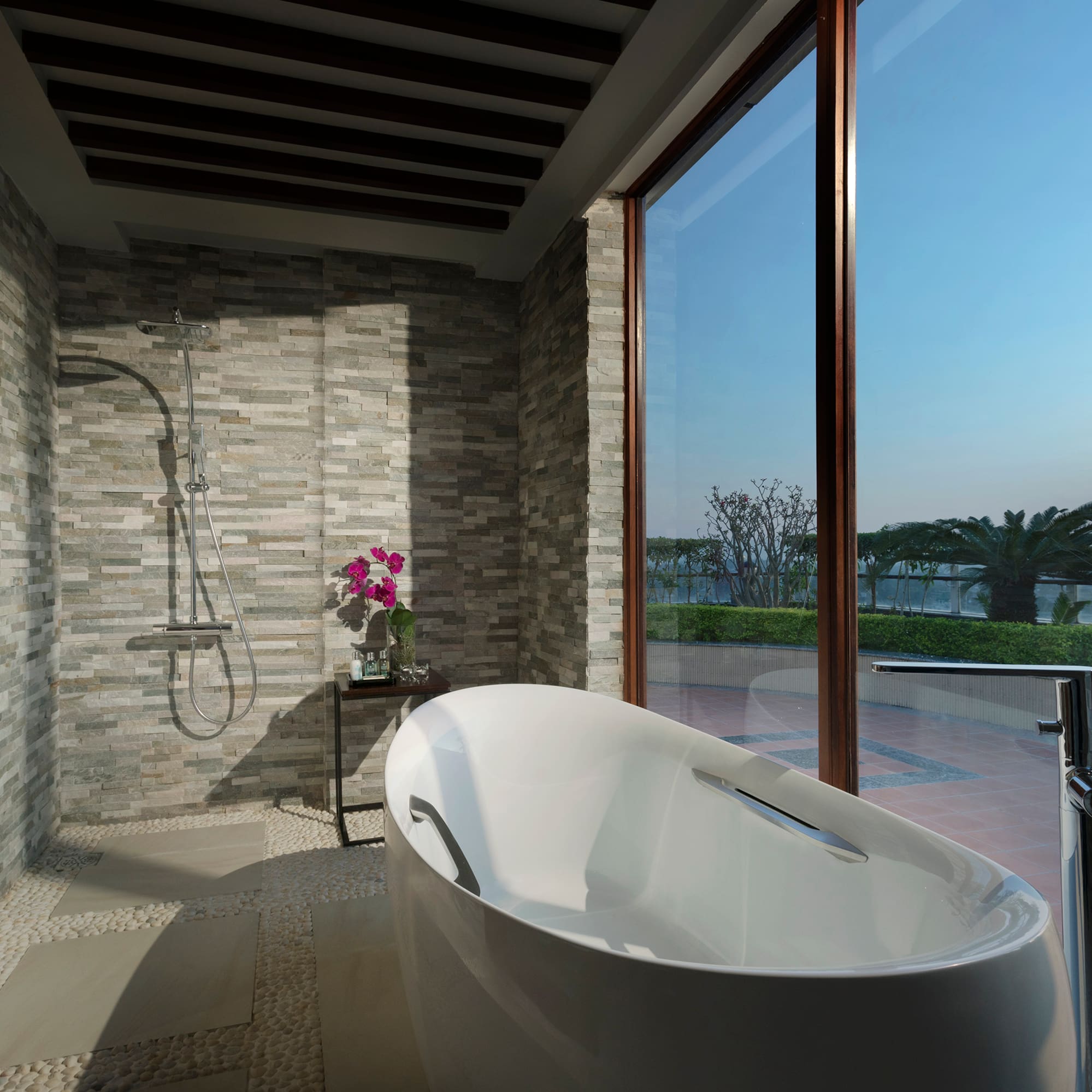 a bathroom with a tub and shower