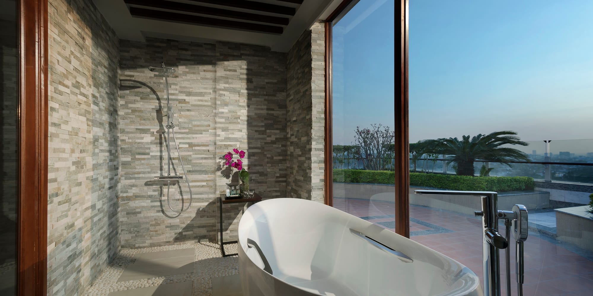 a bathroom with a tub and shower