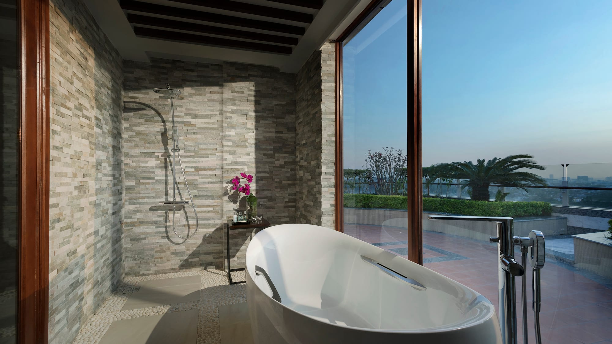 a bathroom with a tub and shower