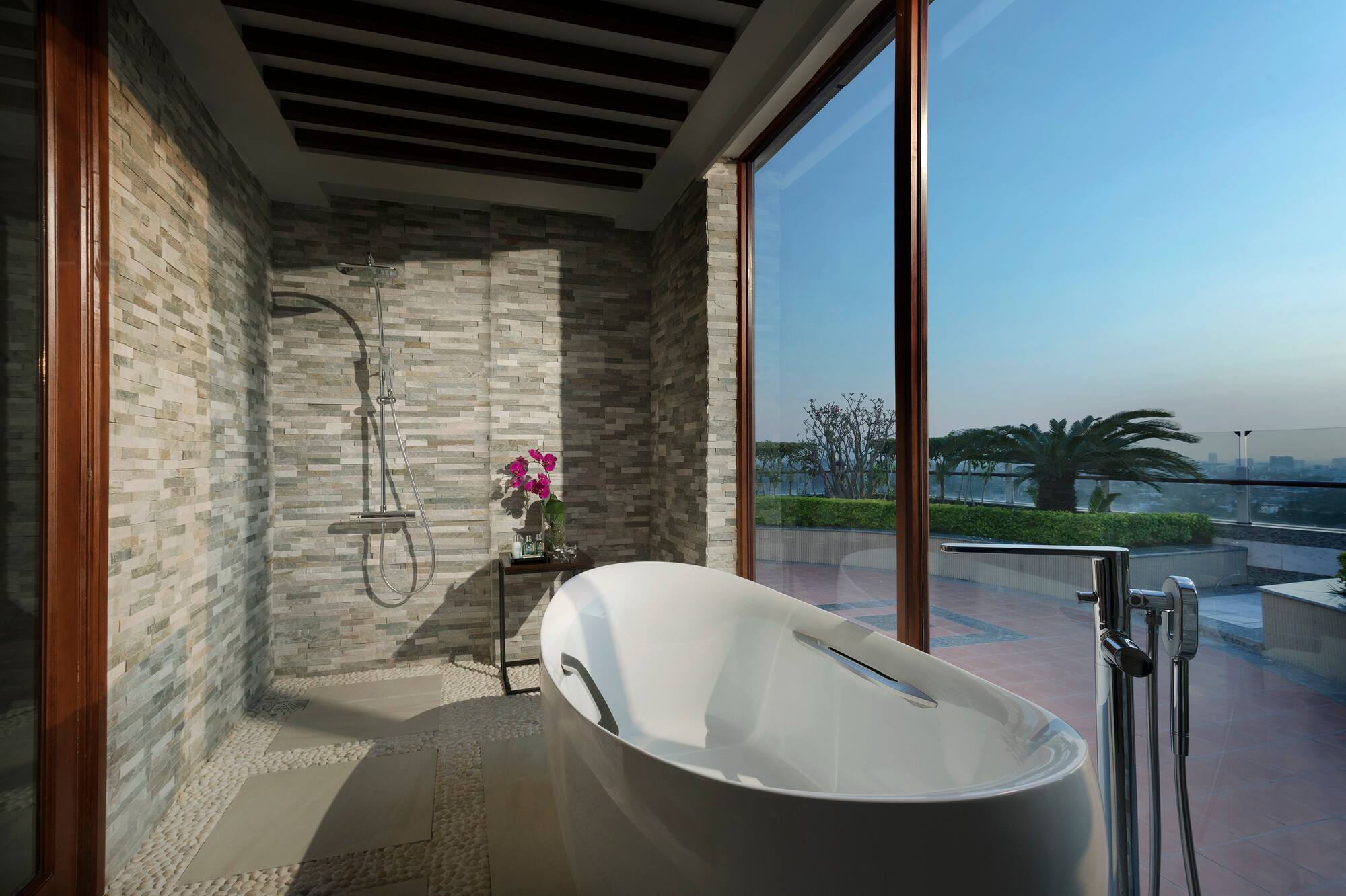 a bathroom with a tub and shower