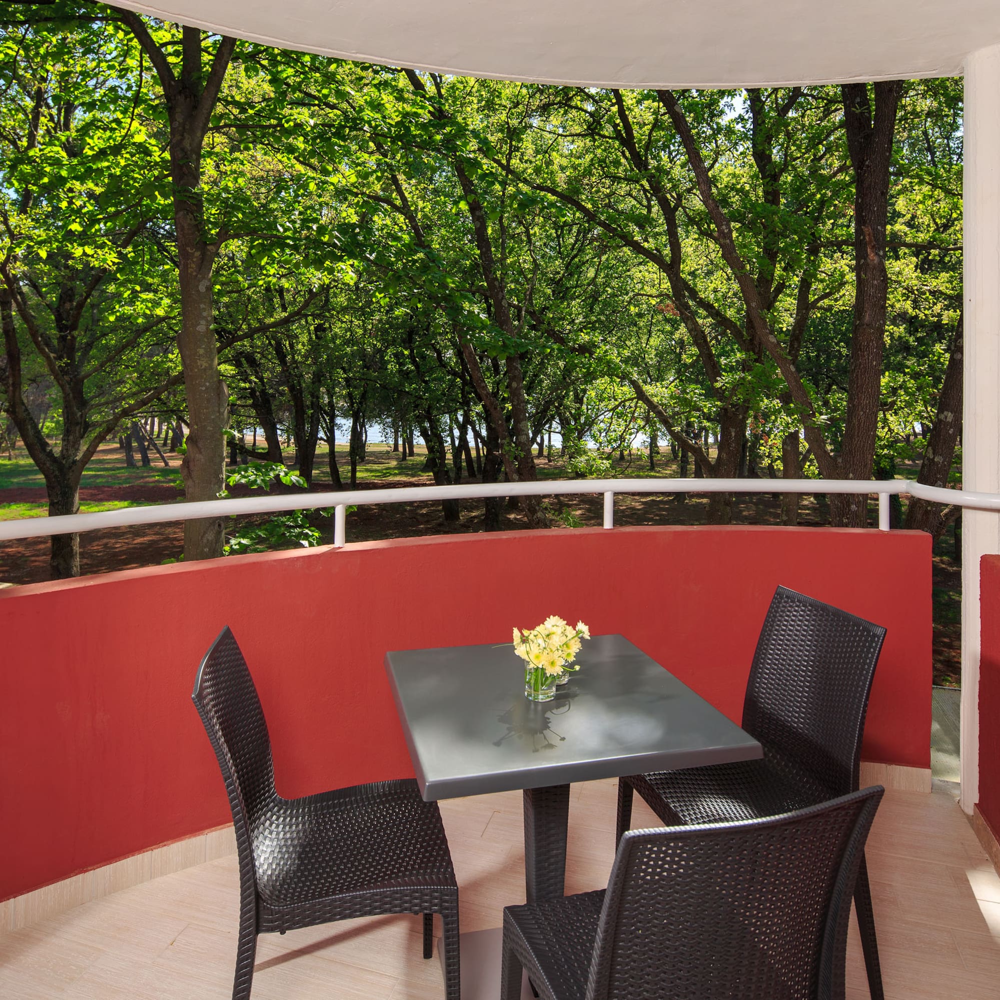 a table and chairs on a balcony