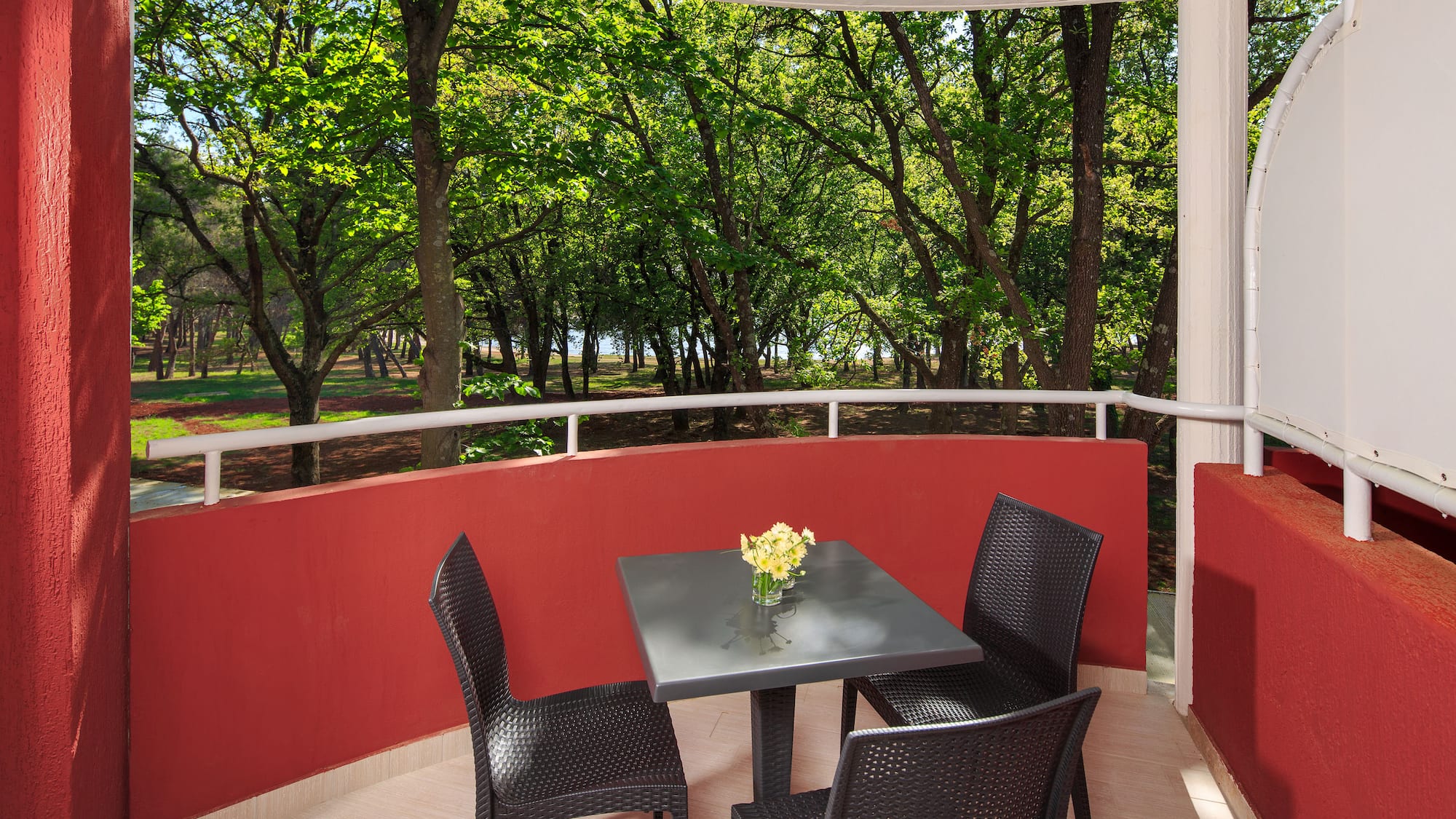 a table and chairs on a balcony