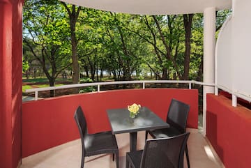 a table and chairs on a balcony