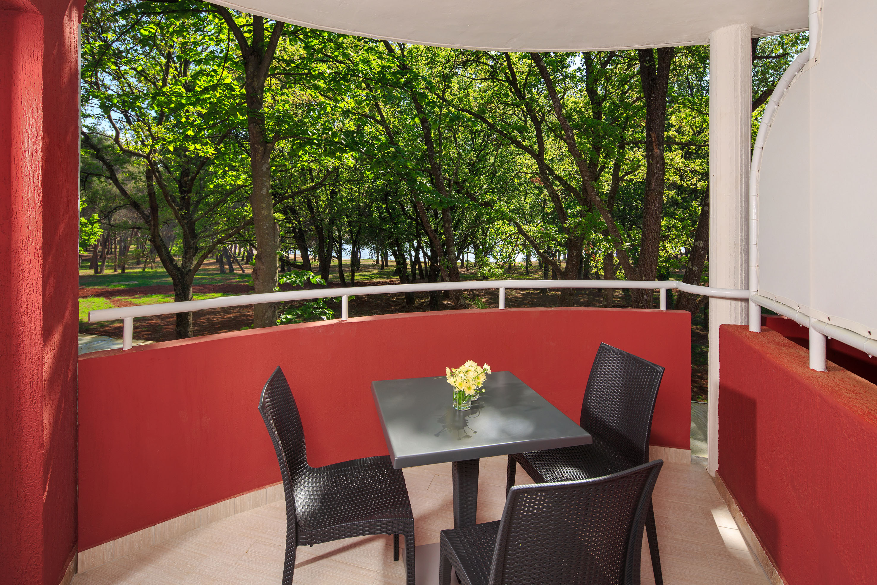 a table and chairs on a balcony