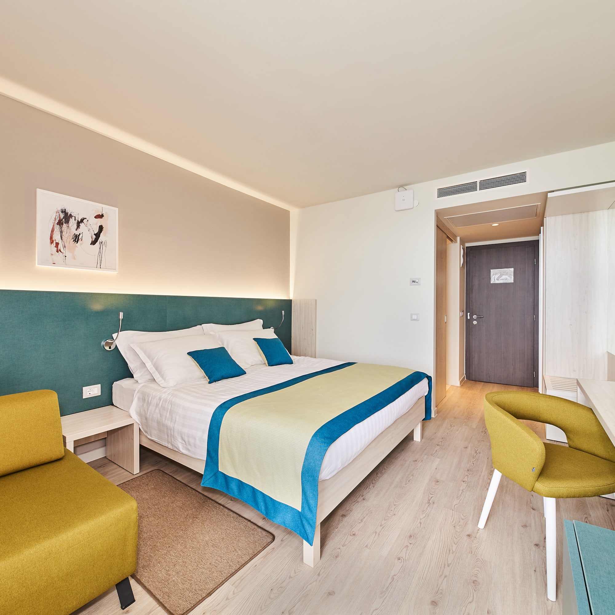 a room with a bed and a chair