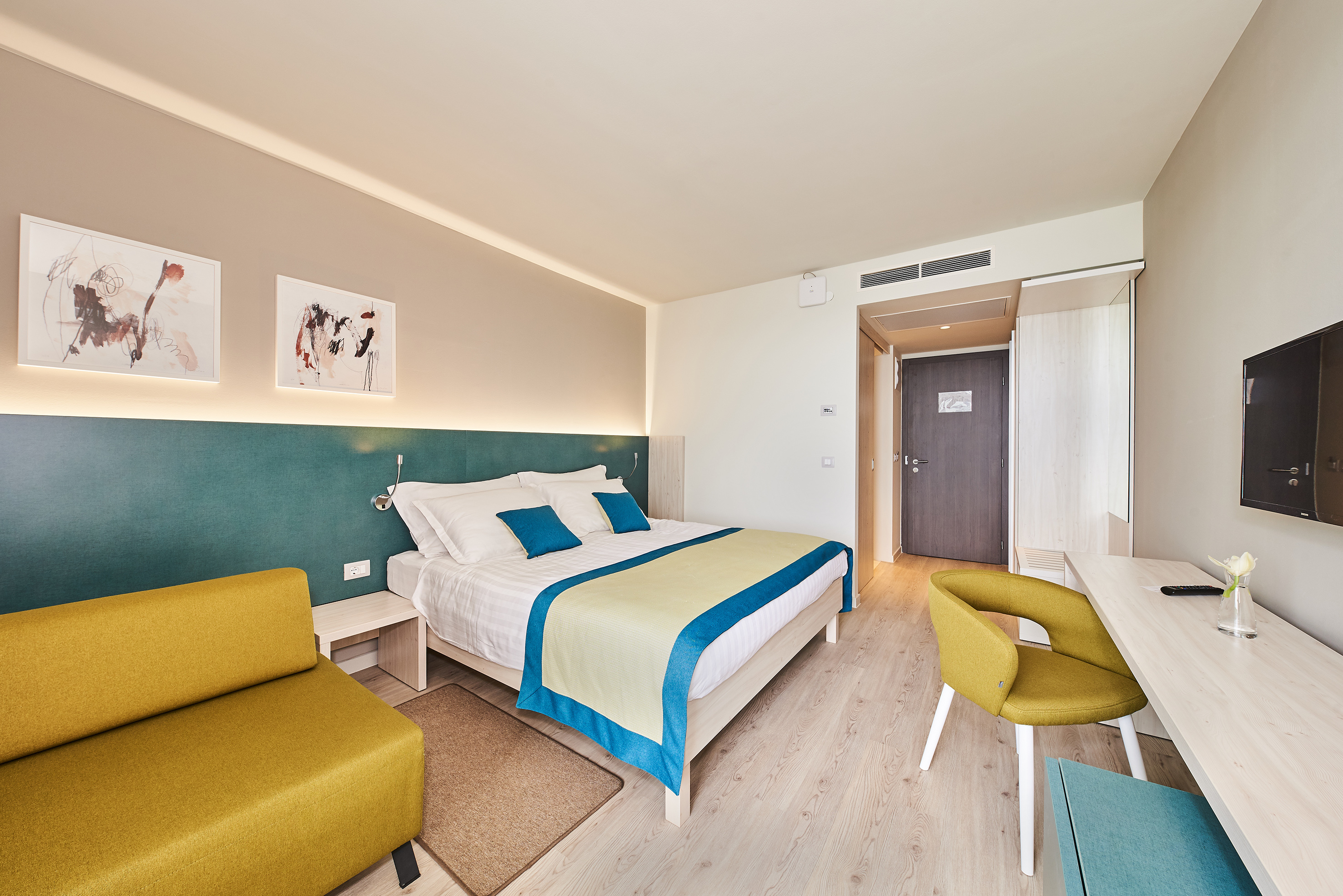 a room with a bed and a chair