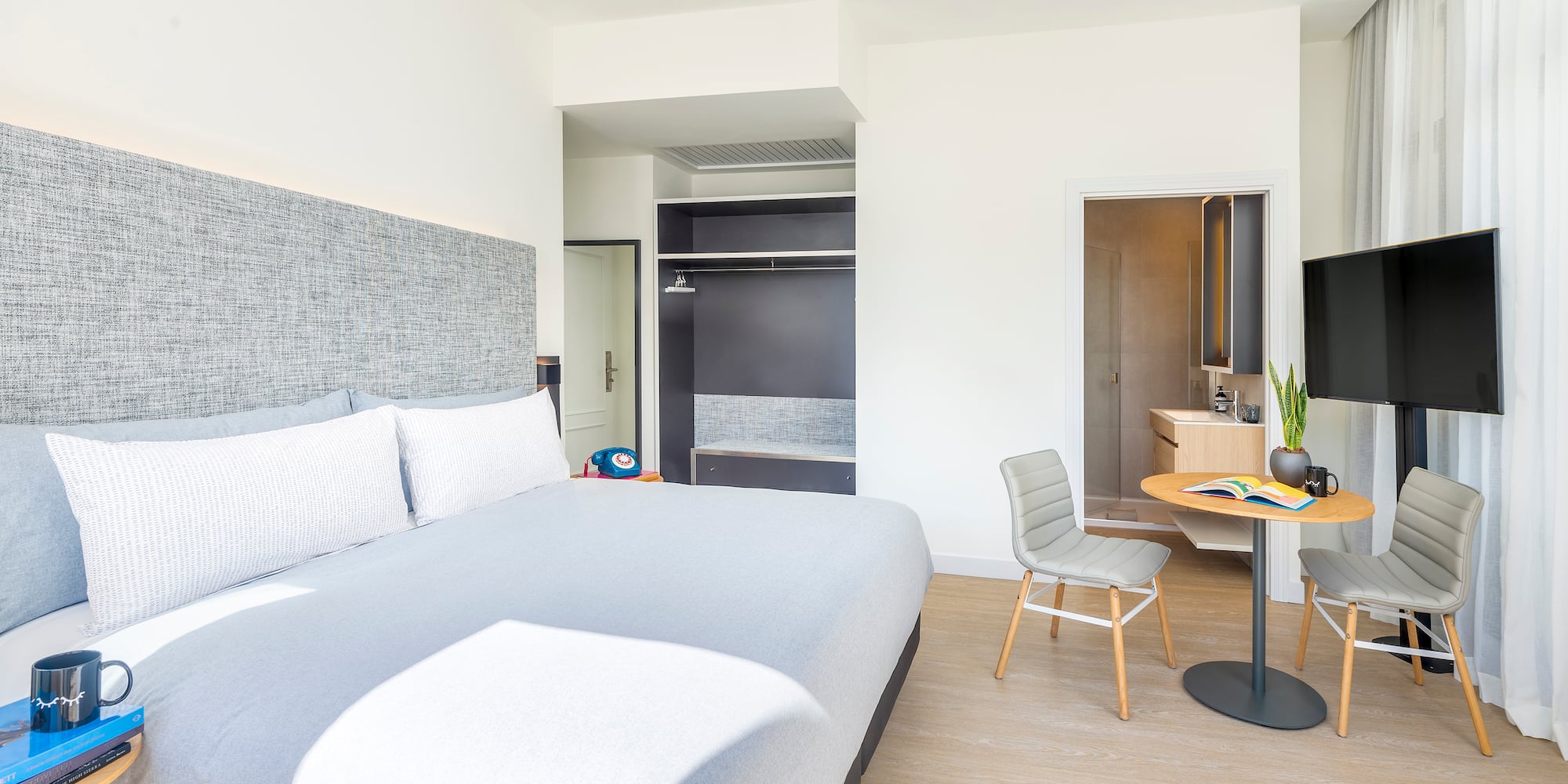 a bedroom with a bed and a desk