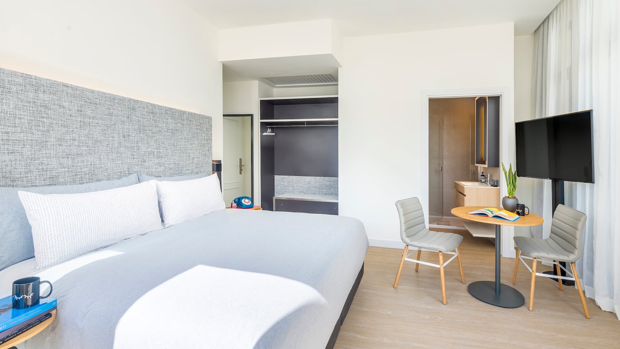 a bedroom with a bed and a desk