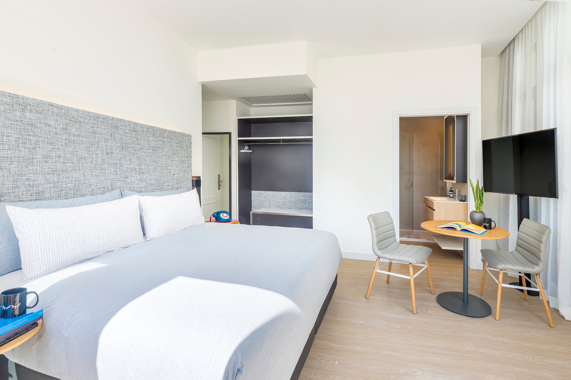 a bedroom with a bed and a desk