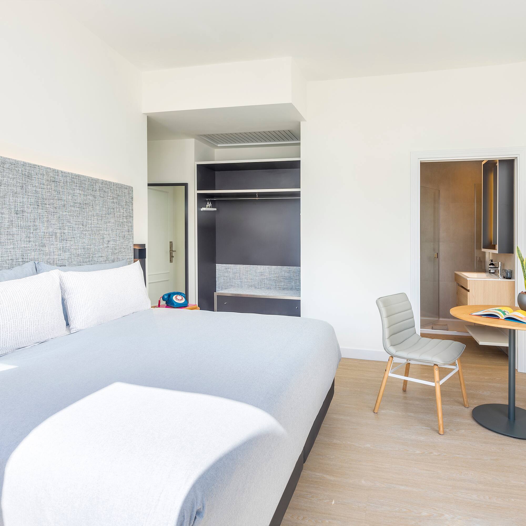 a bedroom with a bed and a desk