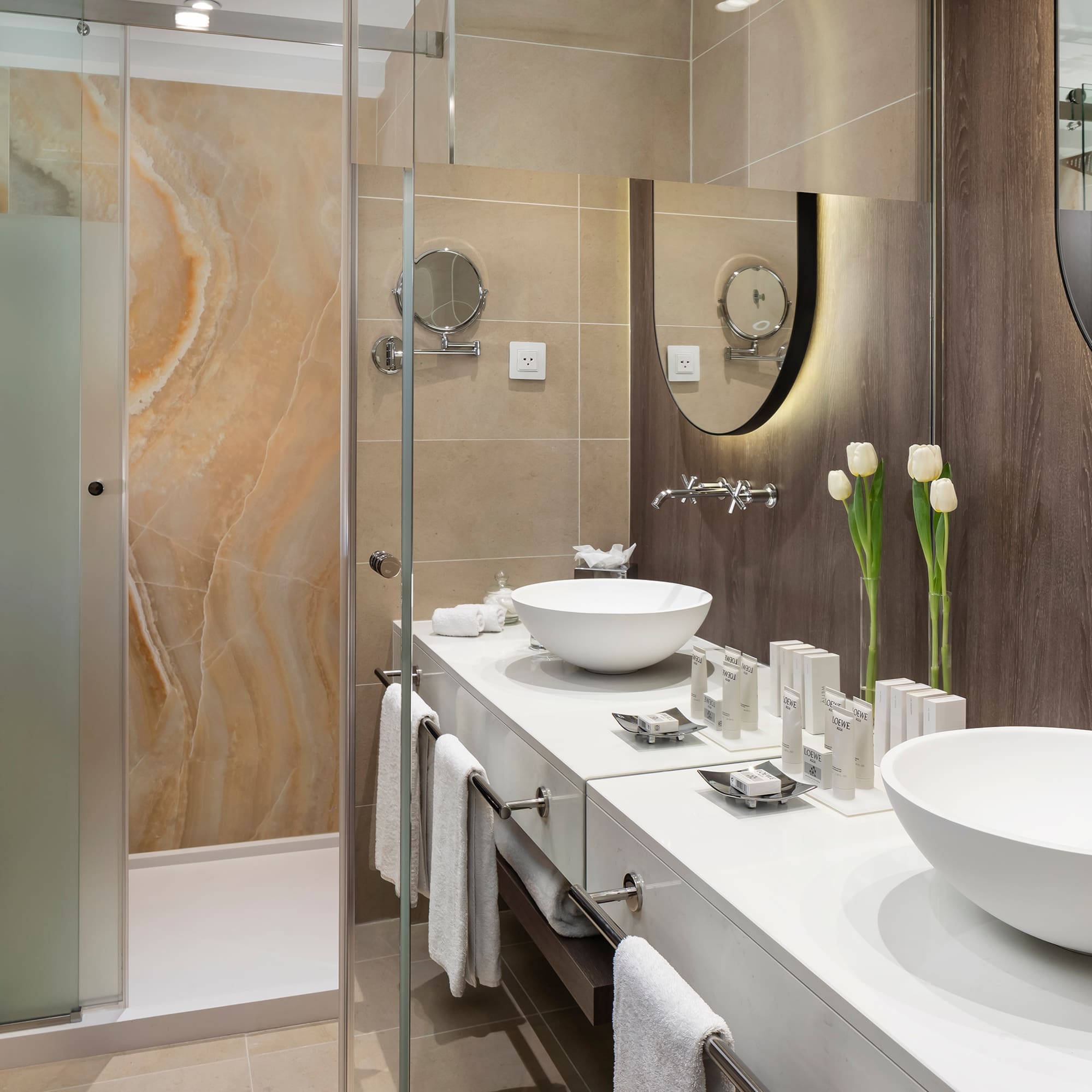 a bathroom with a shower and sink