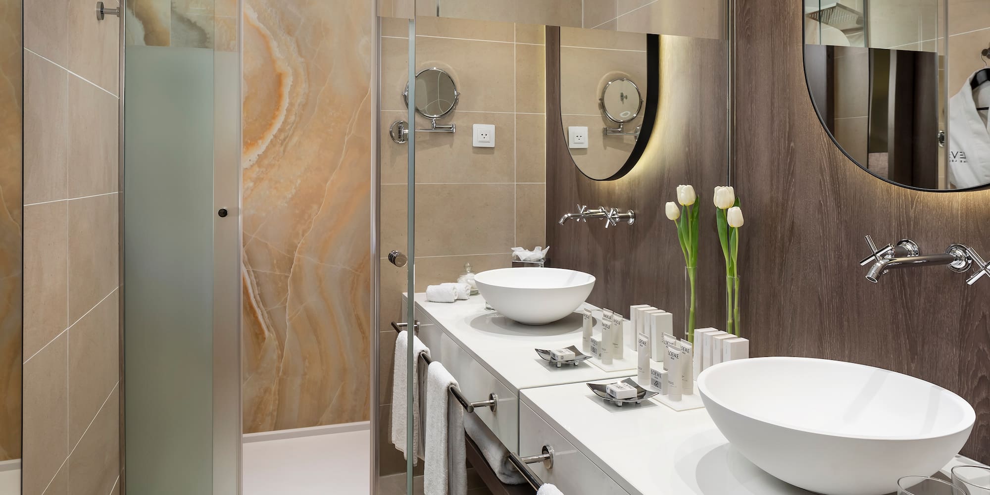 a bathroom with a shower and sink