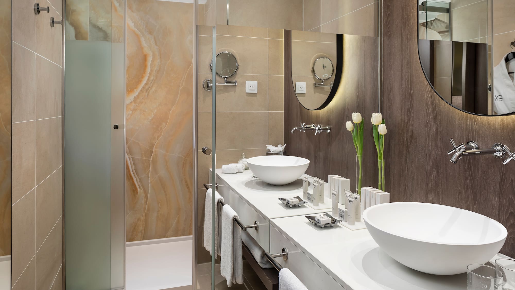 a bathroom with a shower and sink