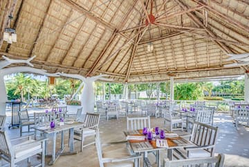 a restaurant with tables and chairs