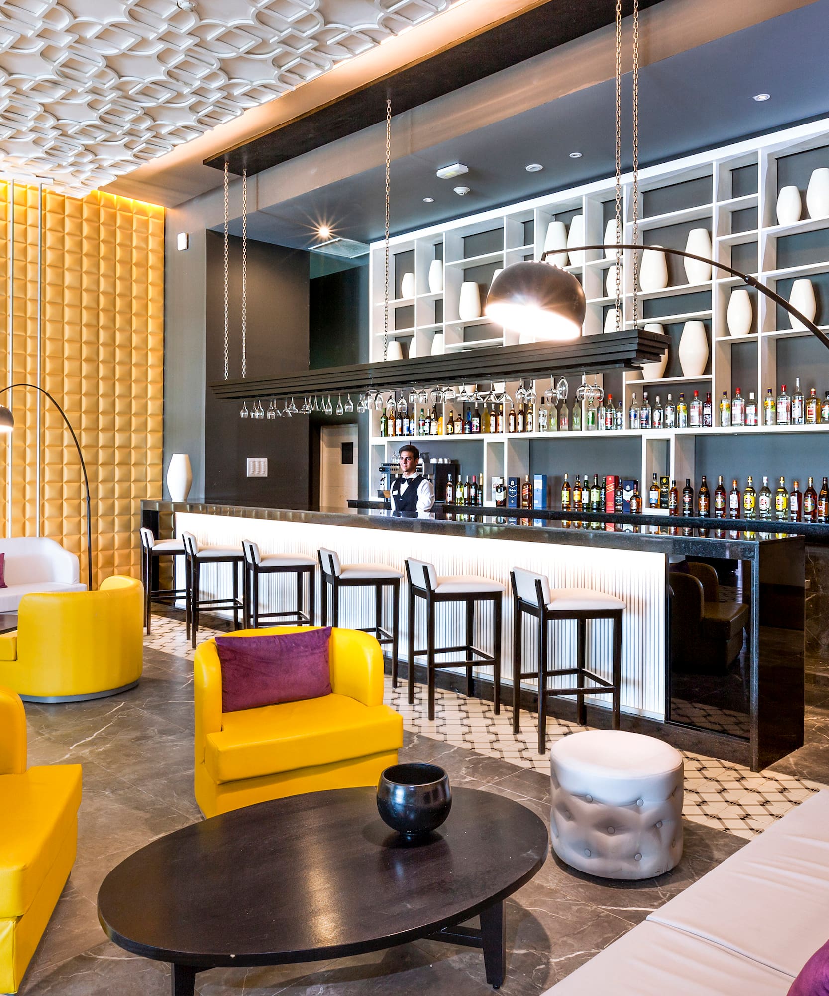 a room with yellow and purple furniture