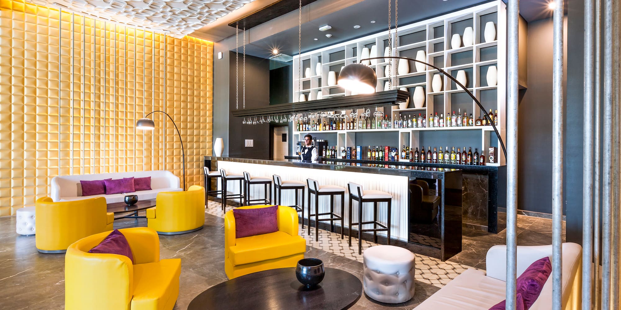 a room with yellow and purple furniture