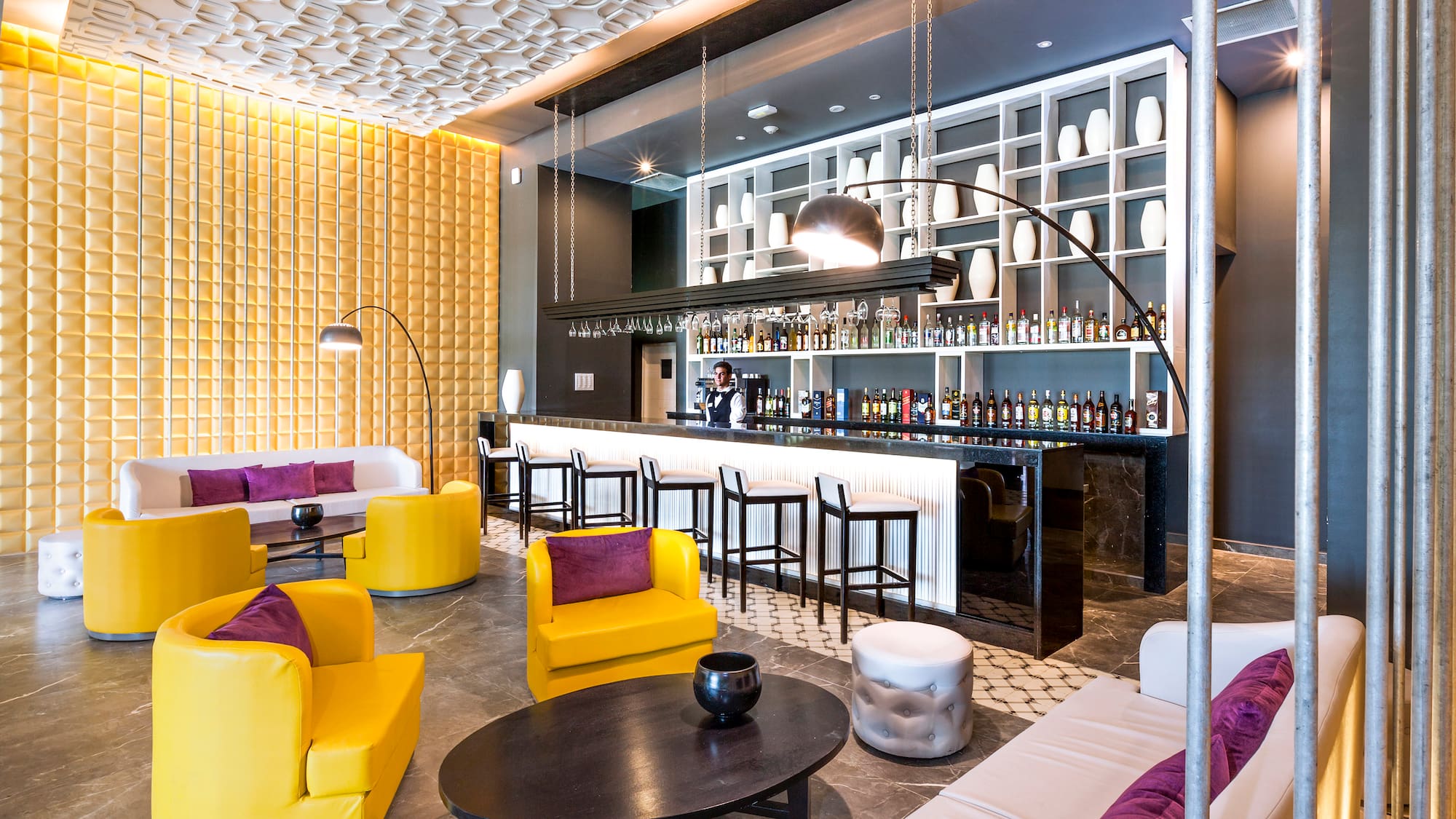 a room with yellow and purple furniture