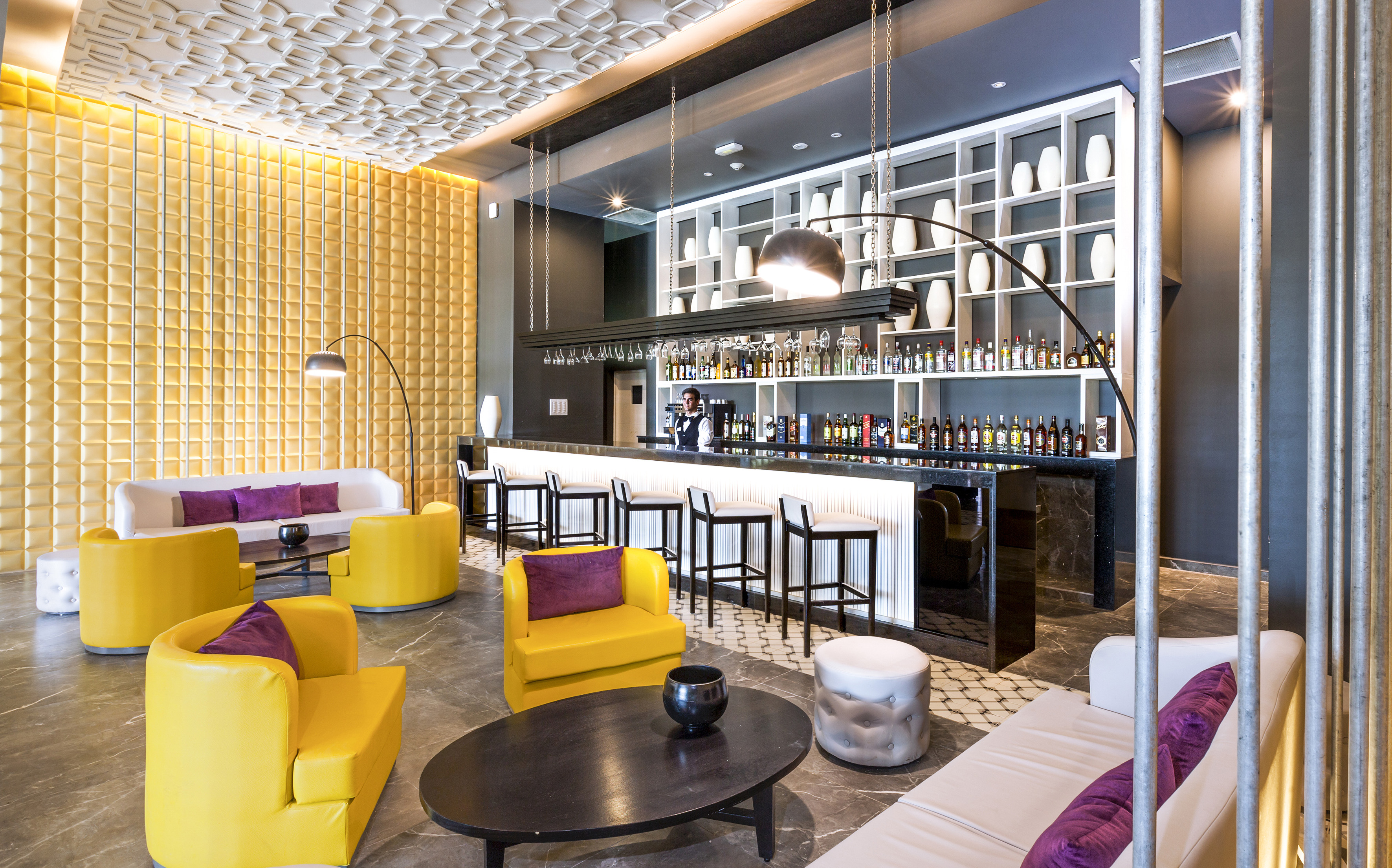 a room with yellow and purple furniture