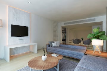 a living room with a television and couches