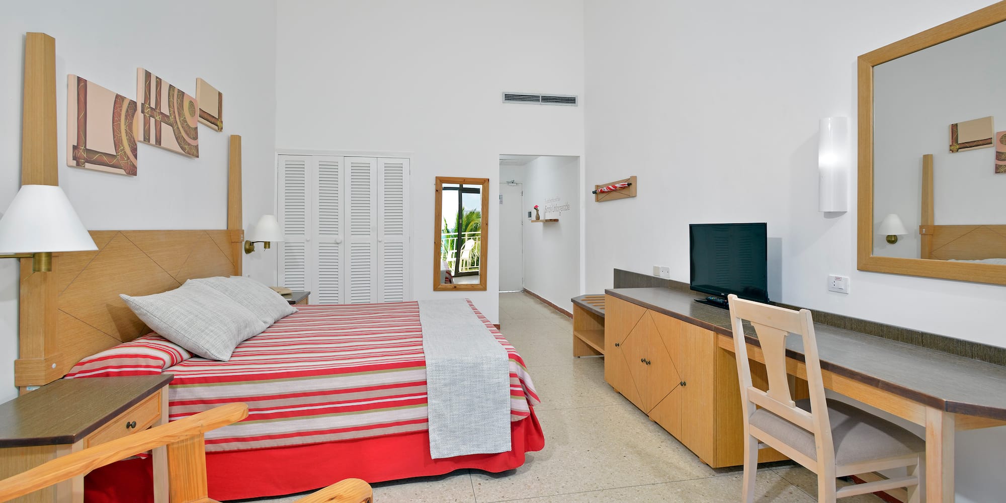 a bedroom with a bed and a desk