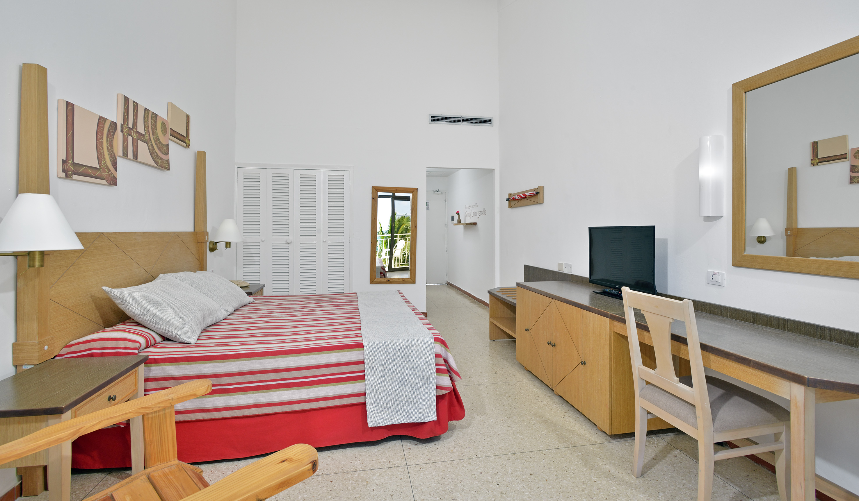 a bedroom with a bed and a desk