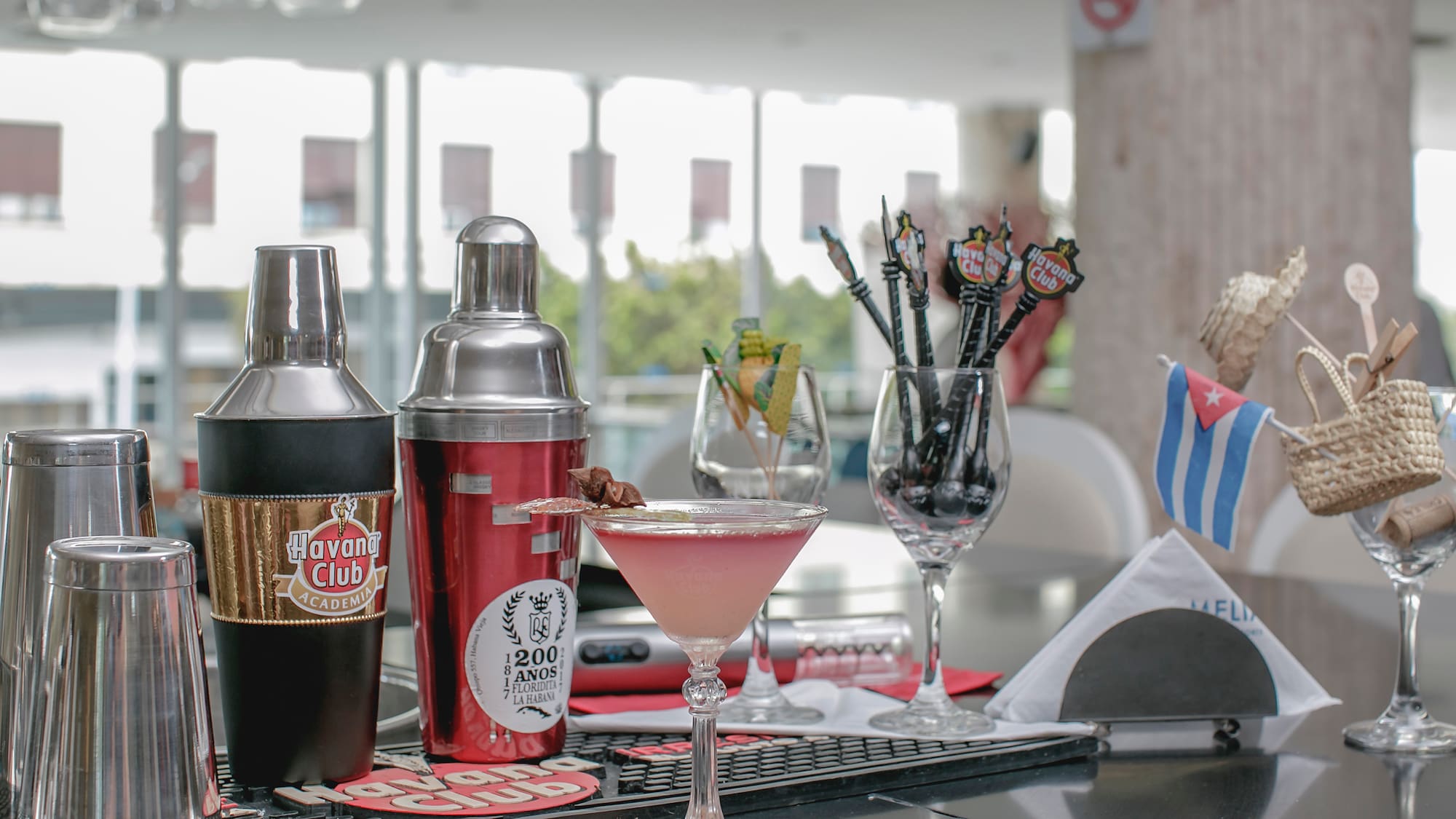 a cocktail shaker and shakers on a table