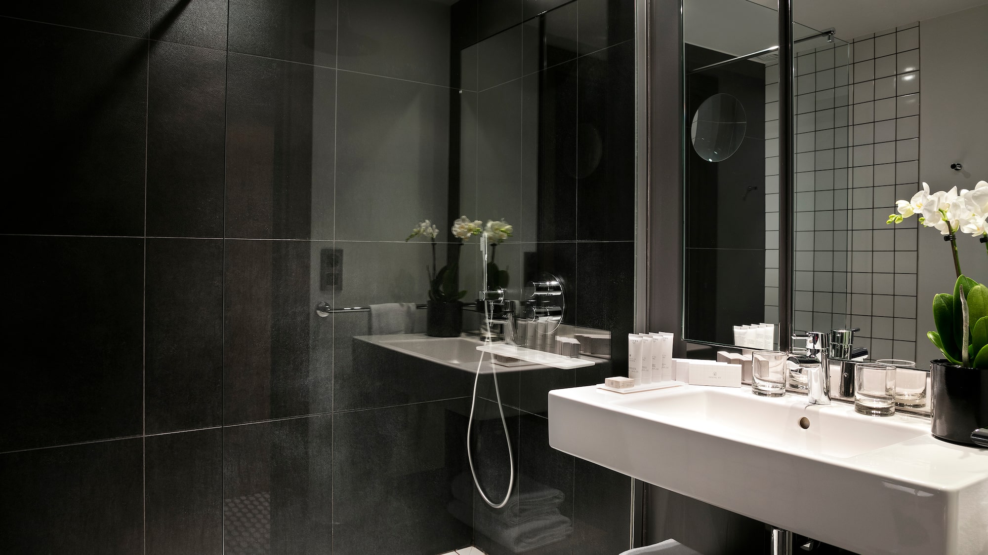 a bathroom with a shower and sink