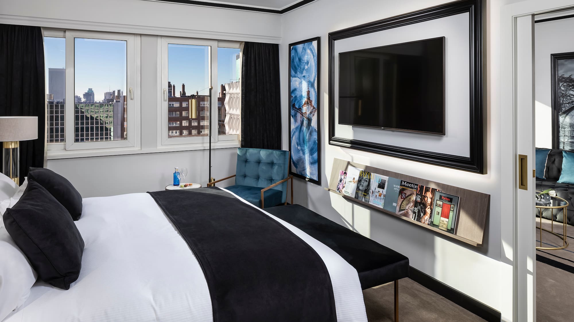 a bedroom with a bed and a chair