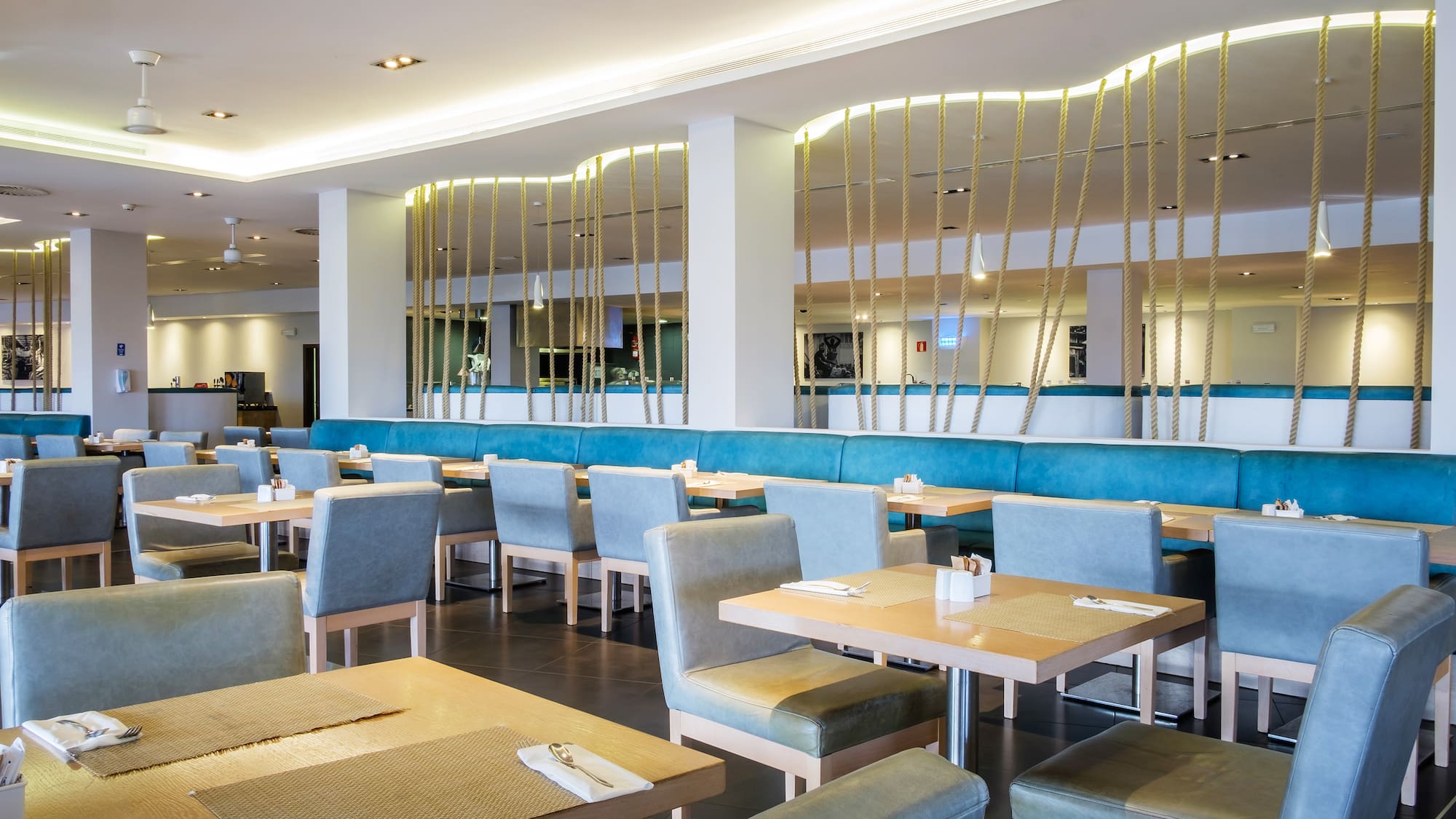 a restaurant with tables and chairs