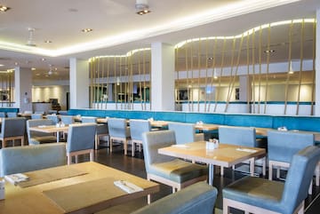 a restaurant with tables and chairs