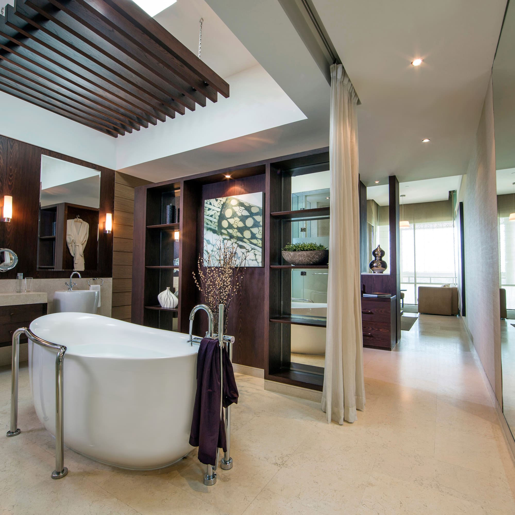 a bathroom with a tub and a shower