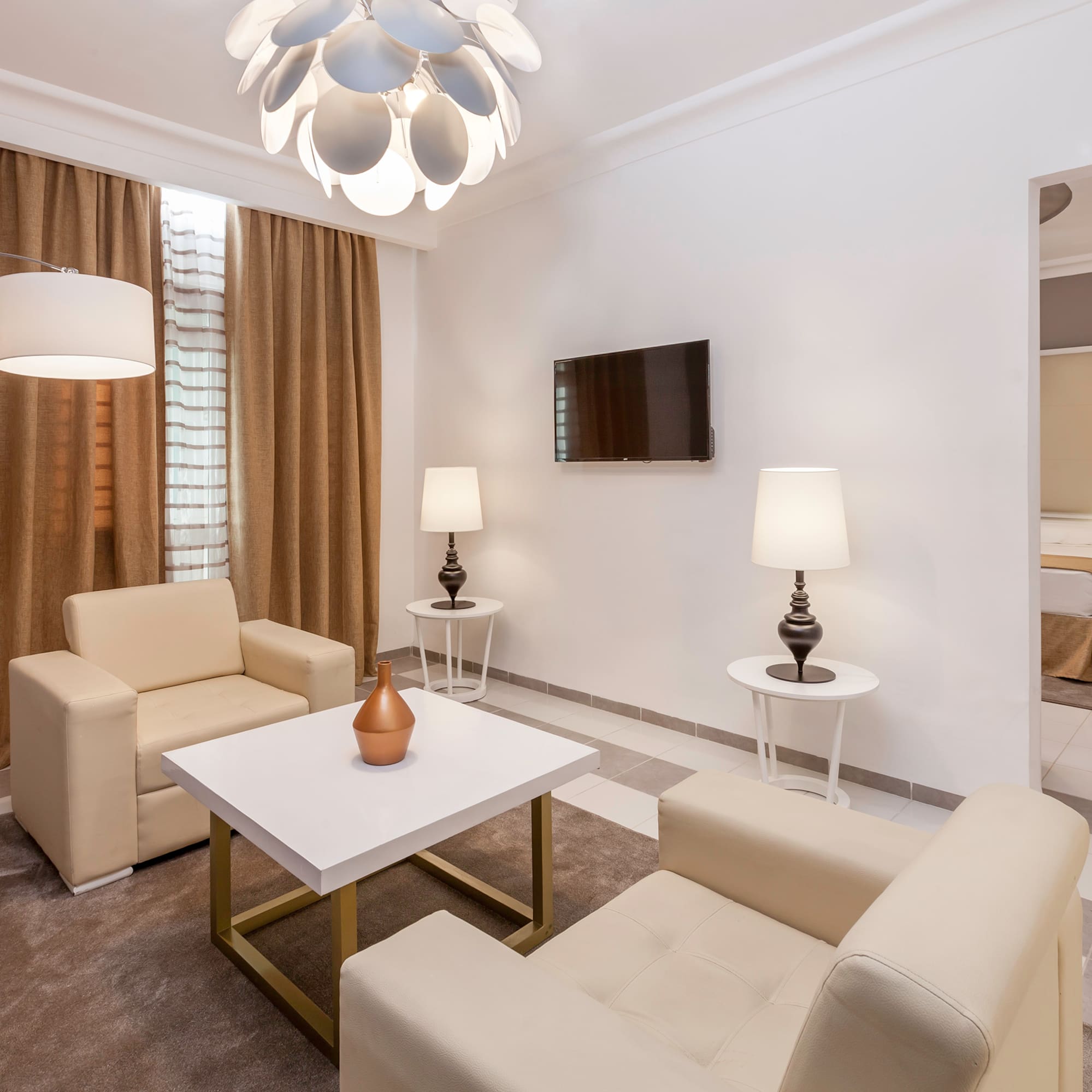 a room with a tv and couches