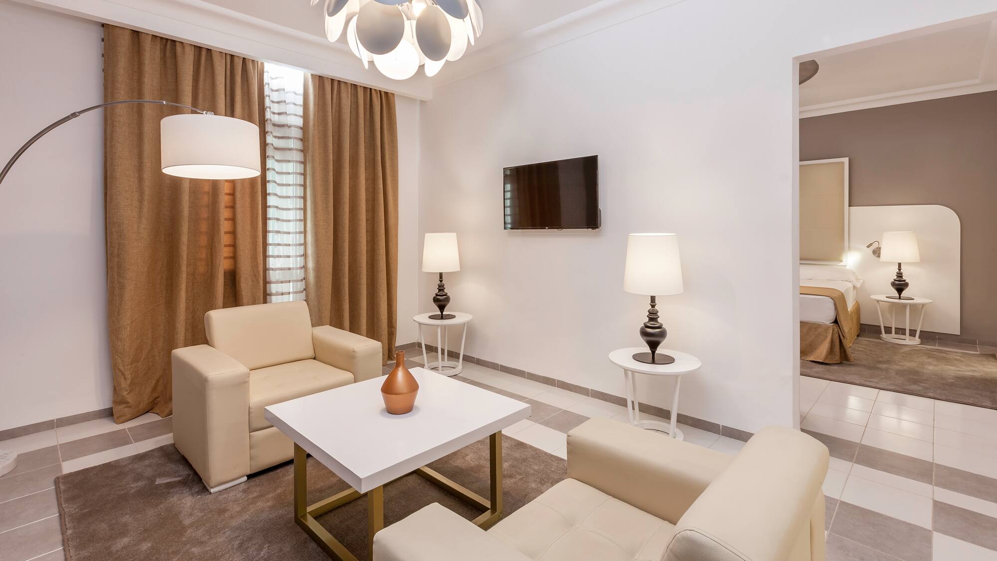 a room with a tv and couches