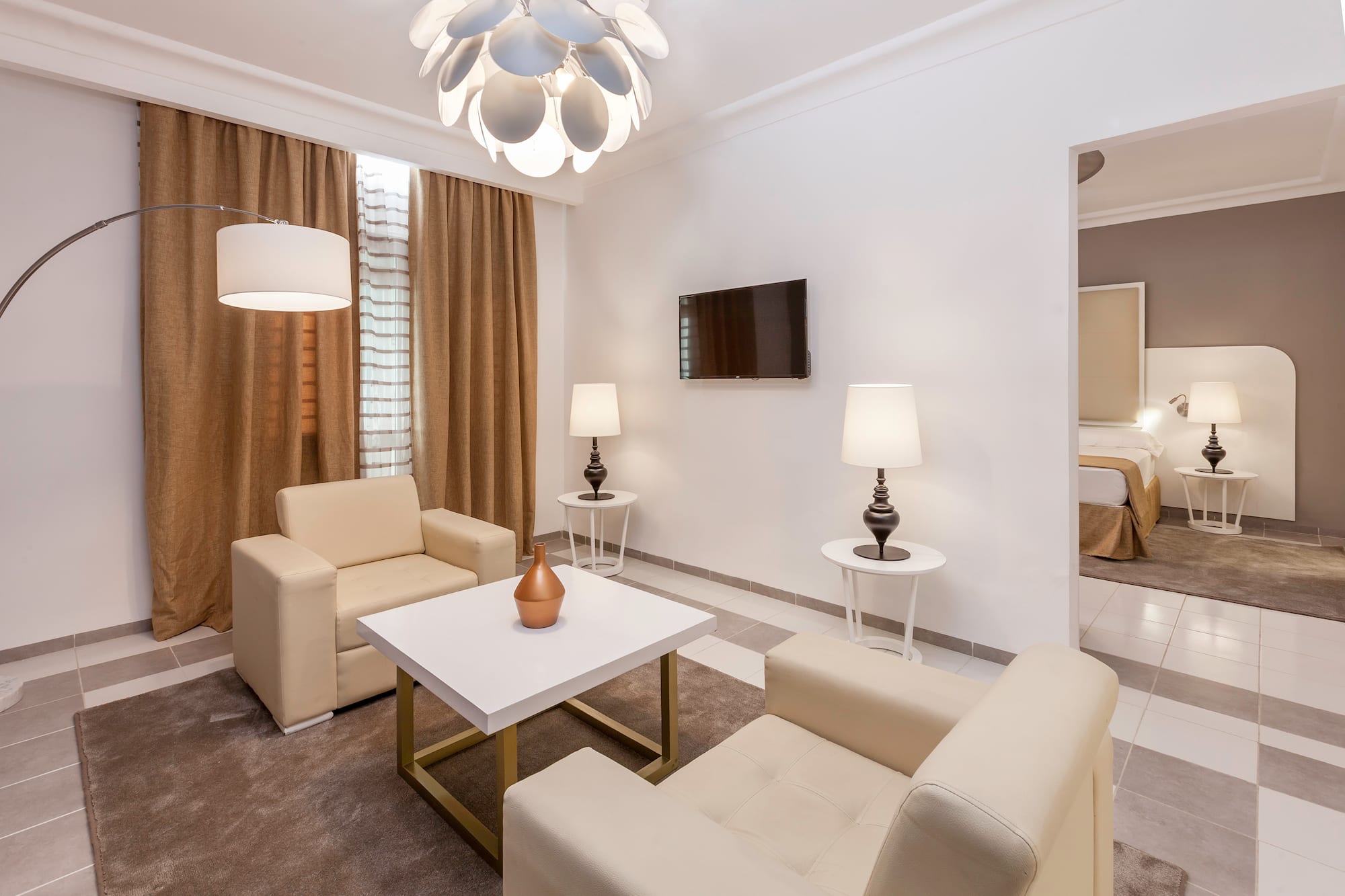 a room with a tv and couches