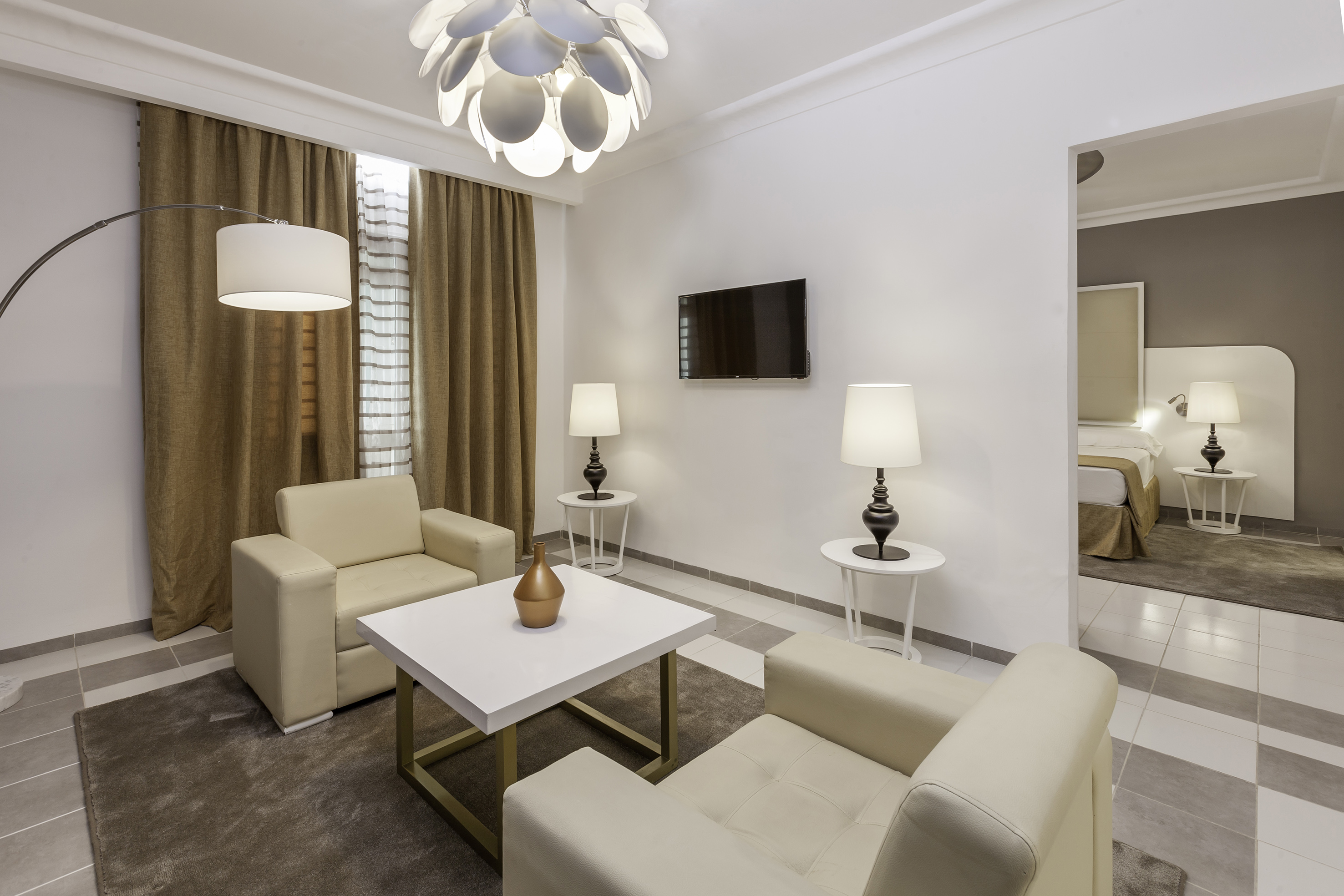 a room with a tv and couches