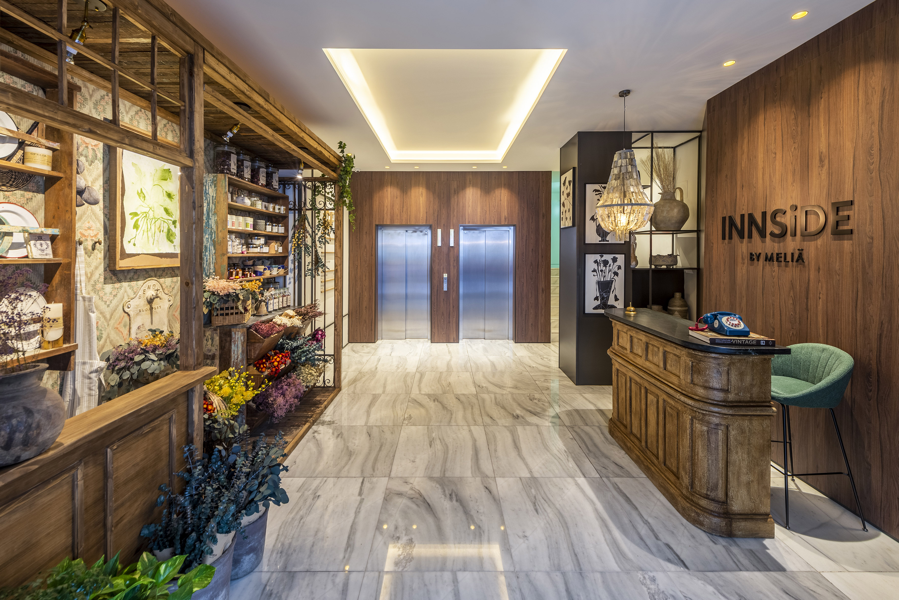 a lobby with a counter and elevator