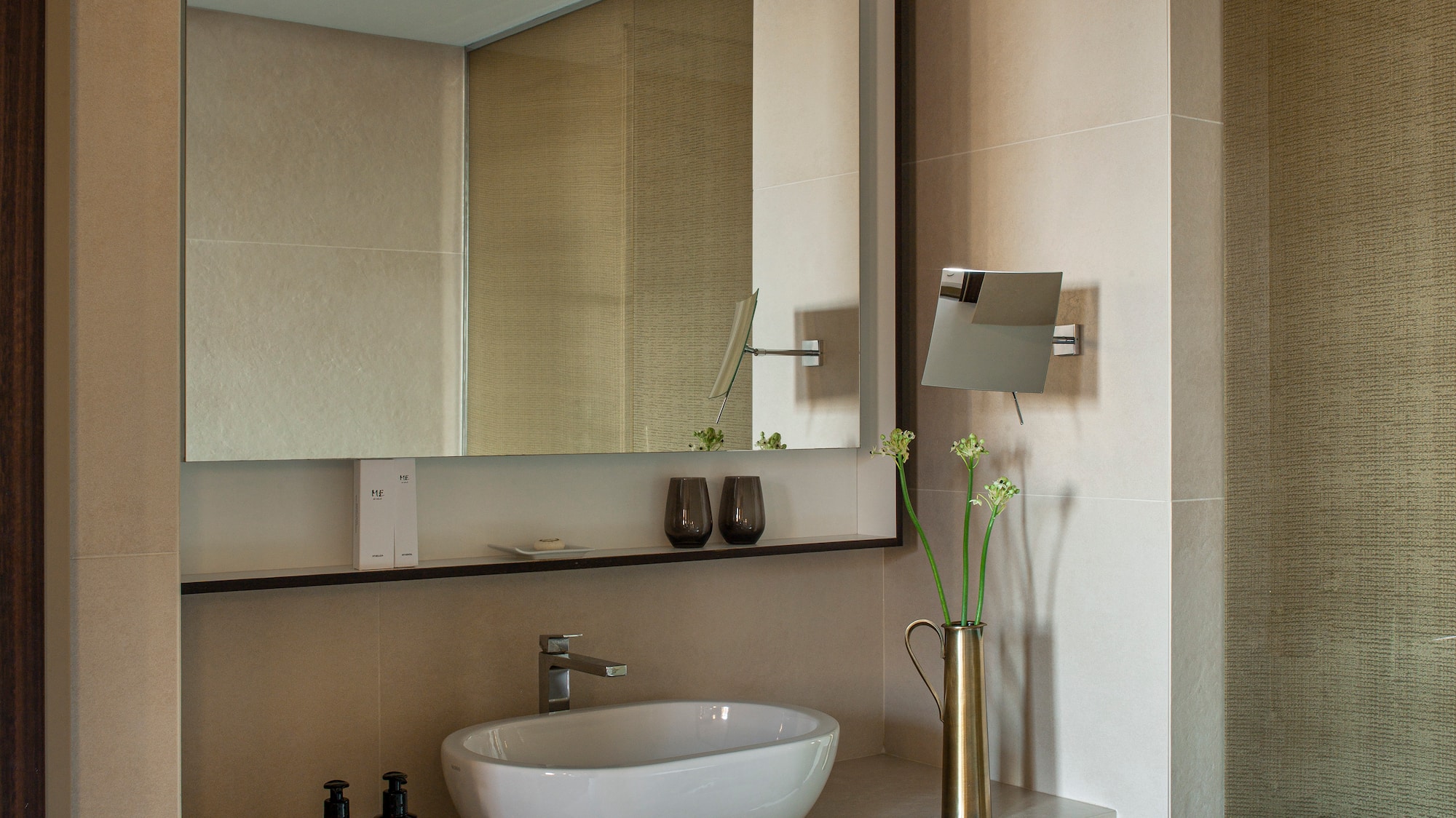 a bathroom with a mirror and sink