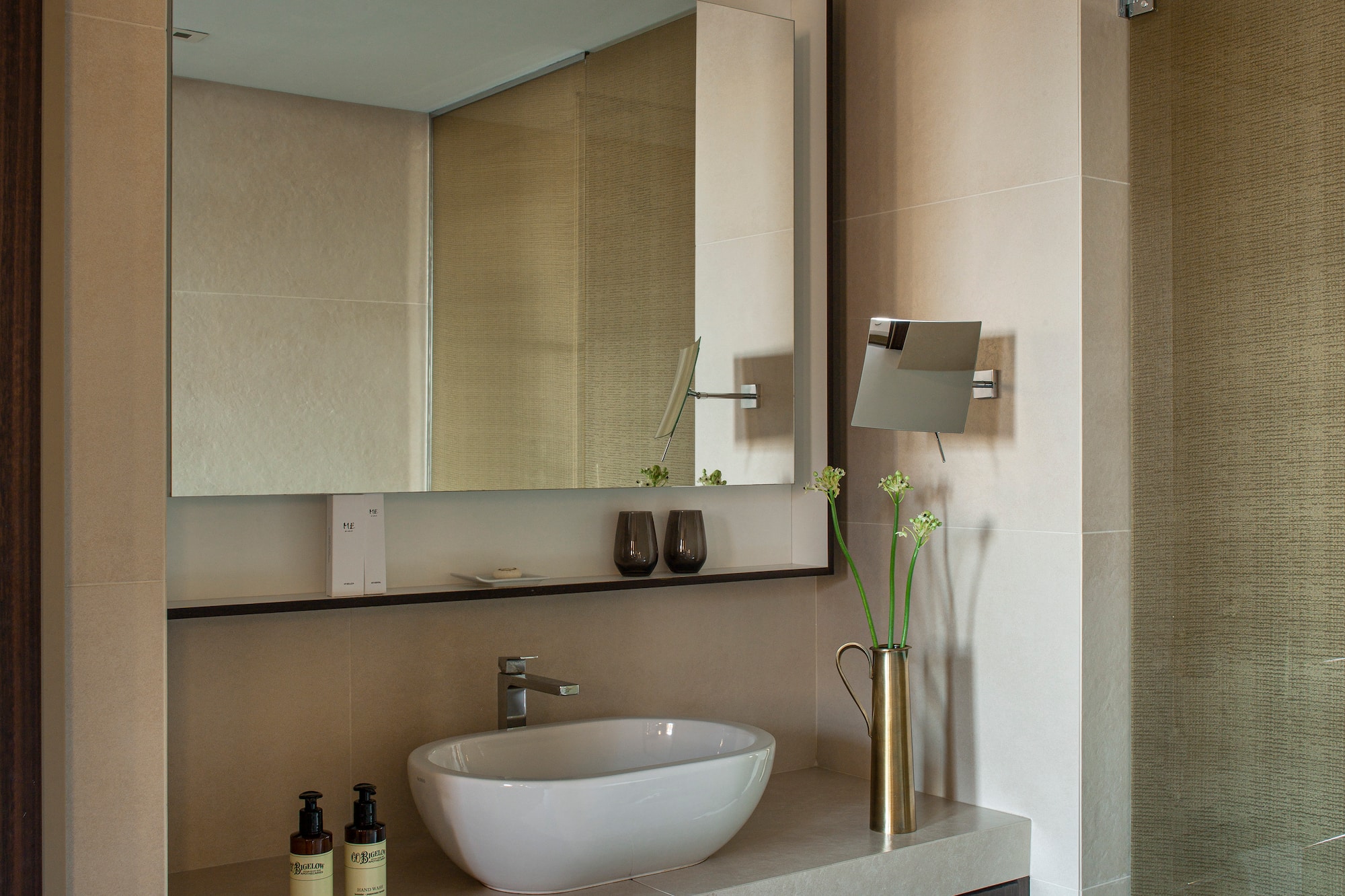 a bathroom with a mirror and sink