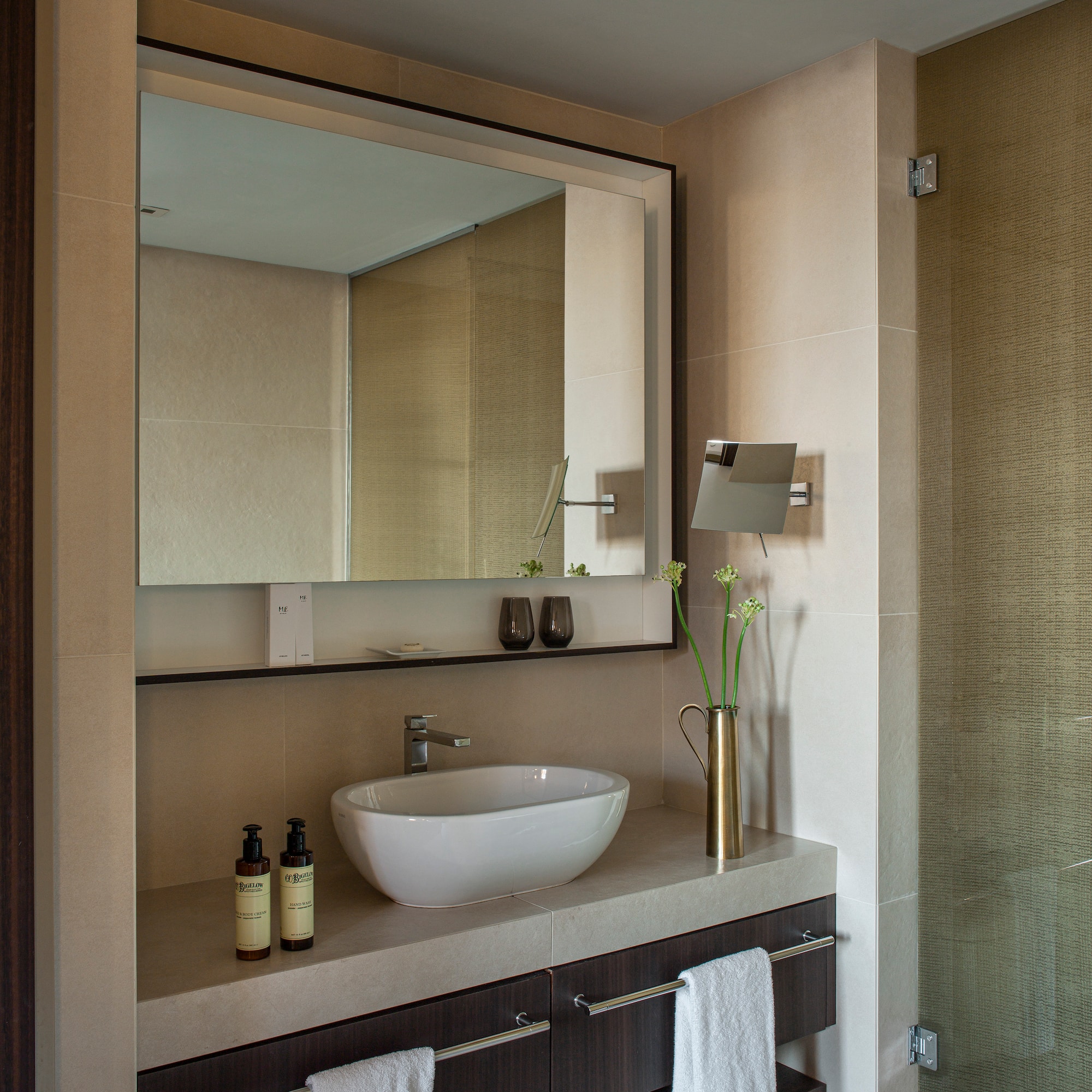 a bathroom with a mirror and sink