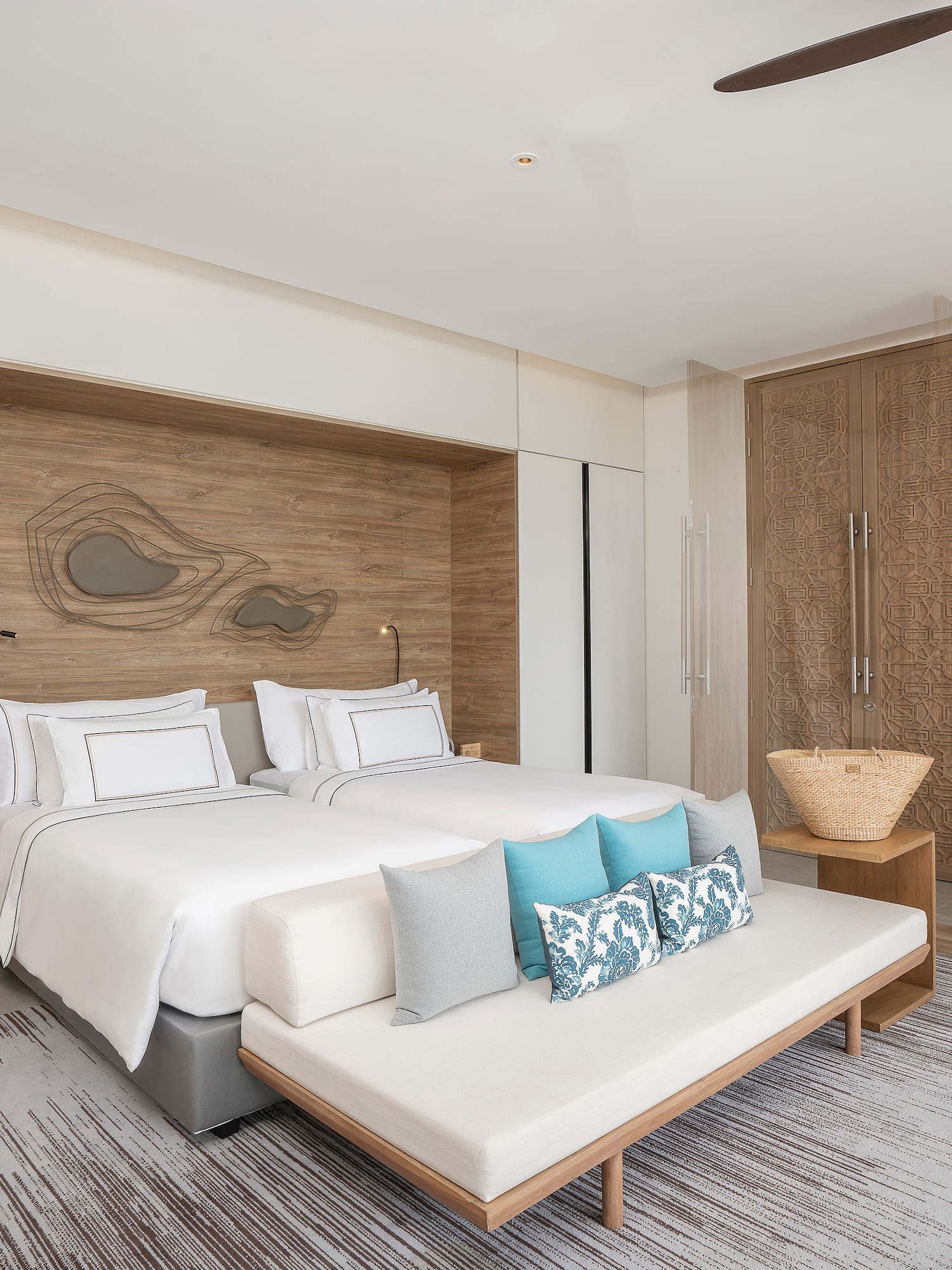 a bedroom with a bed and a fan